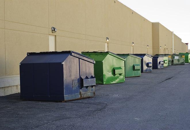 red and green waste bins at a building project in Fort Huachuca